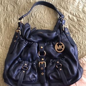 Lightly used authentic Michael Kors hobo handbag.